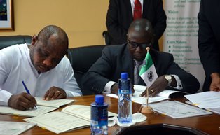 Finance and Development Planning Minister and African Development Bank Country Manager for Liberia Country Office signing the multi donor agreements